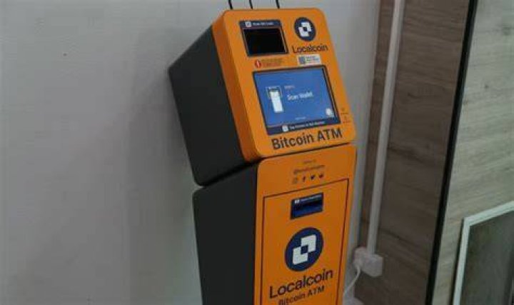How do I deposit money into a Bitcoin ATM?