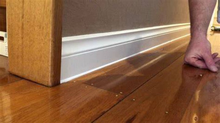 How do you fill the gap between floorboards and skirting boards?