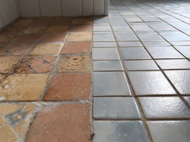 Which tile absorbs less water?